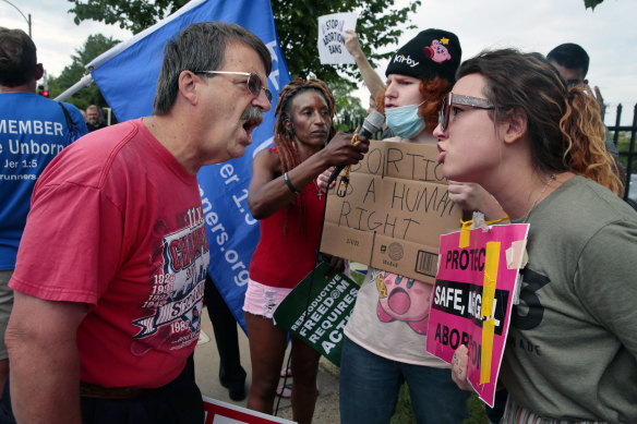 Competing protesters clash outside Planned Parenthood in Missouri following the Supreme Court announcement overturning Roe v Wade.