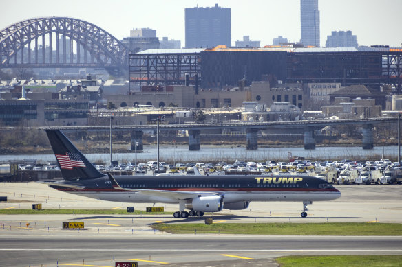 Trump’s plane arrives at LaGuardia Airport in New York with the Hell Gate Bridge in the background.