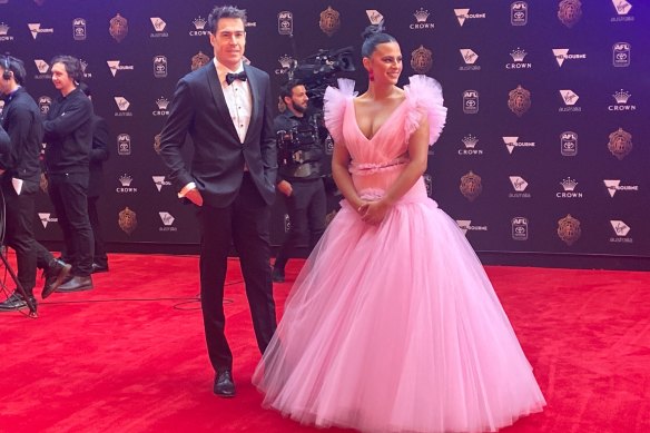 Geelong’s Jeremy Cameron’s partner, Indiana Putra, is setting an early trend of the night - pink!