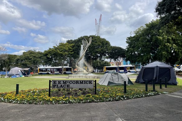 Tents have appeared in one of the city’s busiest intersections, opposite the Roma Street Fire Station just before the William Jolly Bridge.