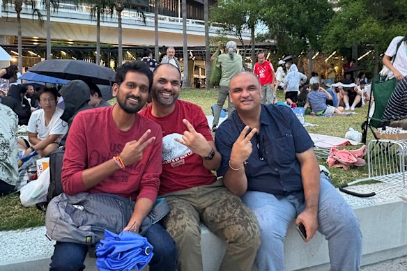 Work friends Ram (left), Shiv (centre), and Sunny (right) were planning to stay in the city with their families until midnight.
