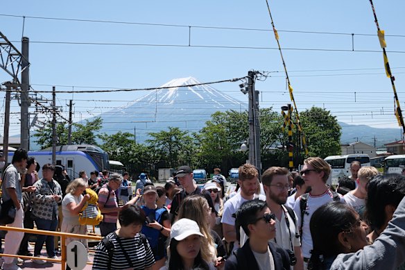 Tourists flock to Mount Fuji.