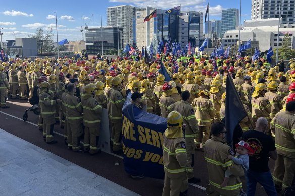 Firefighters turned their backs on Industrial Relations Minister Bill Johnston at a rally on Wednesday.
