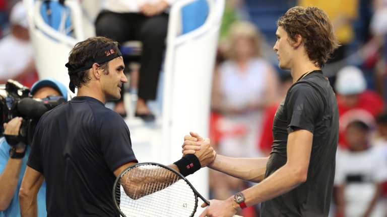 Game, set and match: Federer and Zverev shake hands in Perth.
