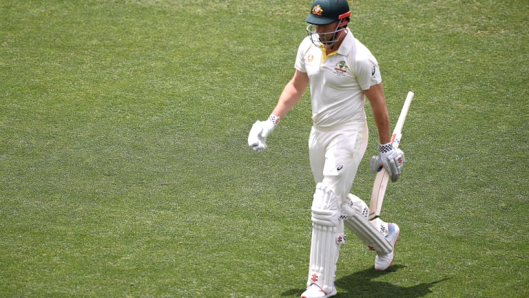 Run of outs: Shaun Marsh leaves the field after being dismissed for two in Adelaide on Friday.