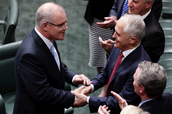 Then treasurer Scott Morrison is congratulated by Malcolm Turnbull after delivering the budget speech in 2018.