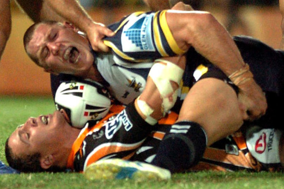 Agony: Luke O'Donnell writhes in pain after the tackle in 2007 that caused him terrible injuries.