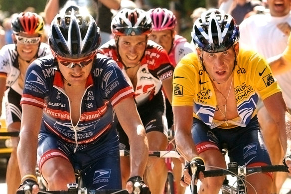 Lance Armstrong, right,  follows compatriot and teammate Floyd Landis, left,  during the 2004 Tour de France.
