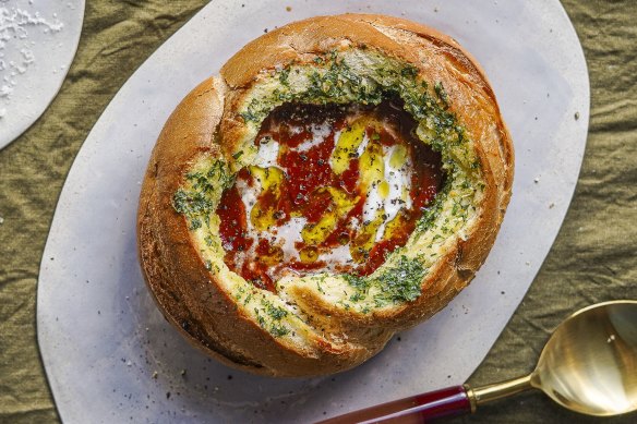 Canned tomato soup is elevated to new heights in this version, served inside a garlic-buttered cob loaf.