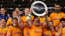 Harry Wilson of the Wallabies celebrates with the Mandela Plate.
