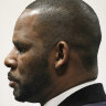 R. Kelly stands during a hearing in his sex abuse case at Leighton Criminal Court Building in May.