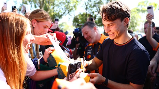 Oscar Piastri signs autographs in Melbourne this week.