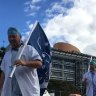 Queensland hospital workers walk off the job over pay freeze