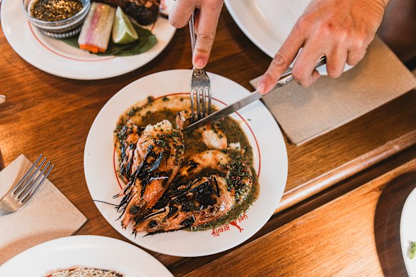 Barbecued king prawns with seaweed powder and finger lime butter sauce.