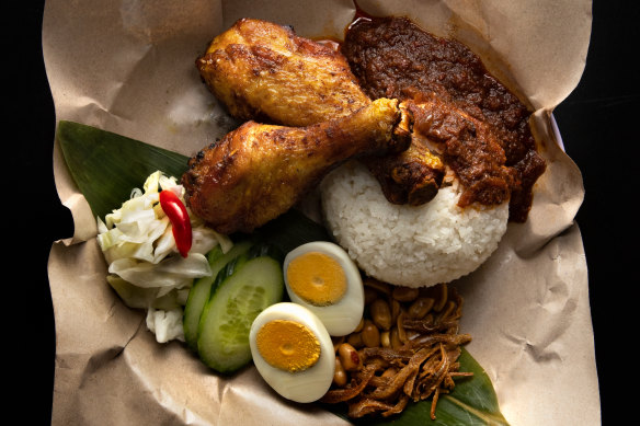  Nasi lemak kukus - coconut rice with peanuts, cucumber and hard-boiled egg, plus turmeric fried chicken and sambal calamari.