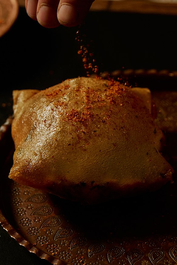 Tunisian pastry filled with tuna, potato, harissa and more.