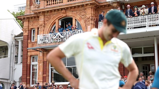 Jonny Bairstow and the England team look on at Lord’s as Australian captain Pat Cummins waits for presentations.