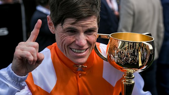 Jubilant jockey Craig Williams celebrates his first Melbourne Cup win.