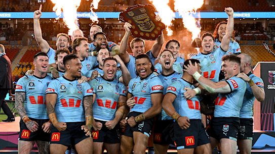 The Blues celebrate with the shield.