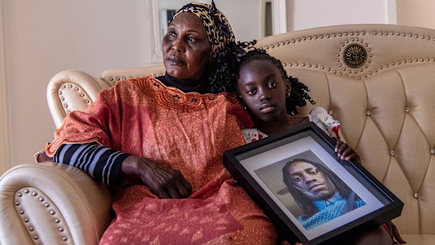 Awatif Ring and granddaughter Achel Myek Ring, with a photo of Achel’s father Myek Ring.