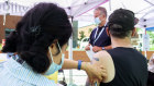 A man receives a monkeypox vaccine at an outdoor walk-in clinic in Montreal at the weekend.