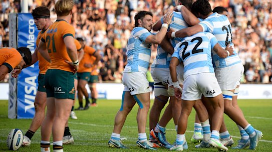 Argentina’s Los Pumas Joaquin Oviedo, center, celebrates with teammates.