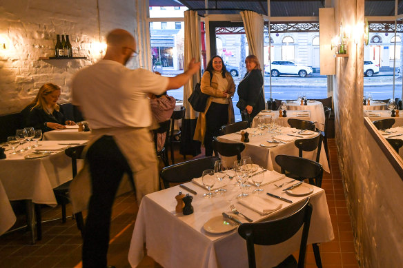 Peek inside Bistra to find white-clothed tables and whitewashed walls.