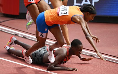 Dutchwoman Sifan Hassan trips during the 1500m heats, but gets back up.