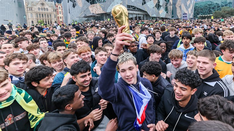 ‘Absolutely crazy atmosphere’: Flares, chants at Federation Square as Socceroos fever takes over Melbourne CBD