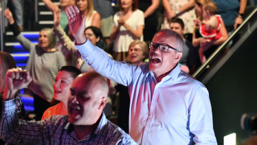 Scott Morrison sings during an Easter Sunday service at his Horizon Church at Sutherland.