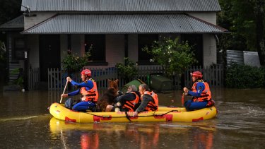 SES teams rescue Windsor residents from their homes during the floods earlier this year.