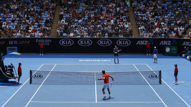 Andy Murray and Novak Djokovic play a practice match at Melbourne Park.