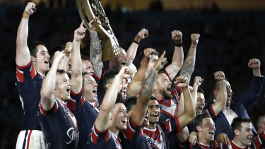 The Roosters lift the NRL trophy for the second time in as many years.