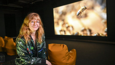 Artist Zanny Begg in front of her work The Beehive at ACMI.