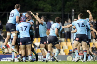 The Waratahs celebrate the mother of all upsets against the Crusaders.