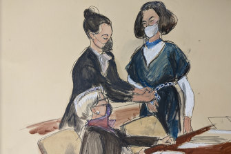 Lawyer Bobbi Sterheim, seated, looks at her client Ghislaine Maxwell while a US marshal removes her shackles, in this court sketch.