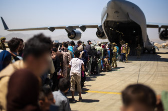 An RAAF flight picking up Afghans in Kabul last month.