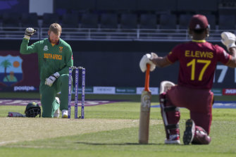South Africa’s Heinrich Klaasen, left, and West Indies’ Evin Lewis take the knee before the start of the game on Tuesday.