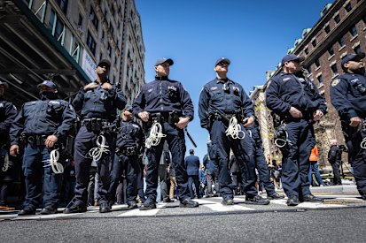 NYPD officers from the Strategic Response Group form a wall of protection against the pro-Palestinian protest encampment at Columbia University.  