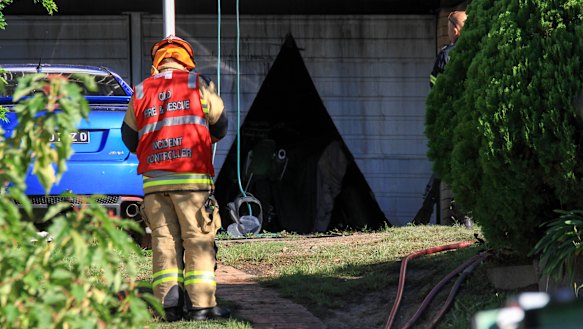 Firefighters had to cut their way into the garage.