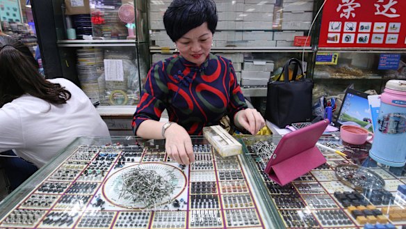A shop owner at the electronics and comupter market in Shenzhen’s Huaqiangbei.