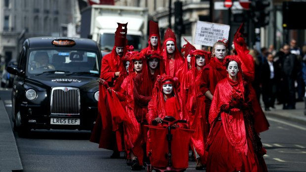 Members of Red Brigade march from Oxford Circus to Piccadilly Circus in London on Wednesday.