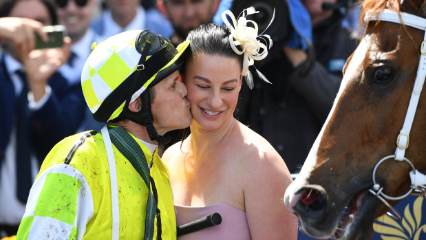  Takeover bid: Eduardo trainer Sarah Zschoke gets a kiss from jockey and partner Brian Park.