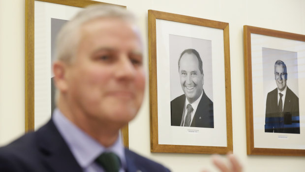 A portrait of former Nationals leader Barnaby Joyce hangs on the wall behind Deputy Prime Minister Michael McCormack. 