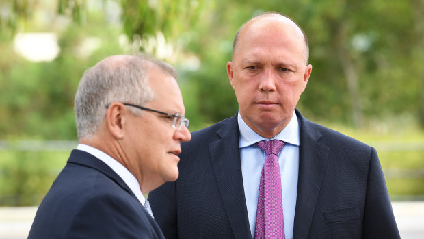 Australian Prime Minister Scott Morrison (left) and Minister for Home Affairs Peter Dutton.