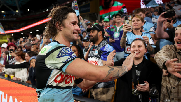 Sharks halfback Nicho Hynes greets fans at Magic Round.