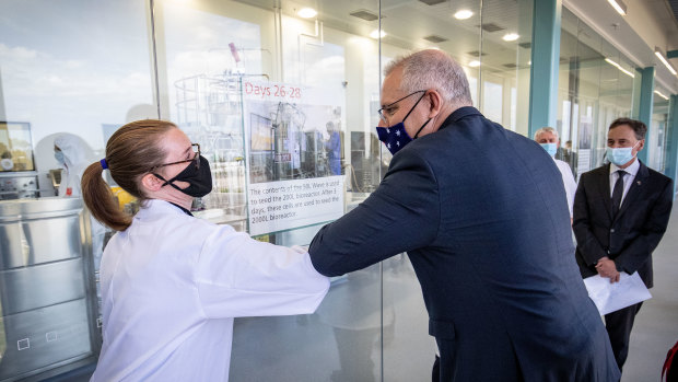 Prime Minister Scott Morrison last week as he was shown the CSL Lab where a COVID-19 vaccine is being worked on. While a vaccine is on the way, many economies are likely to bear COVID scars for years.