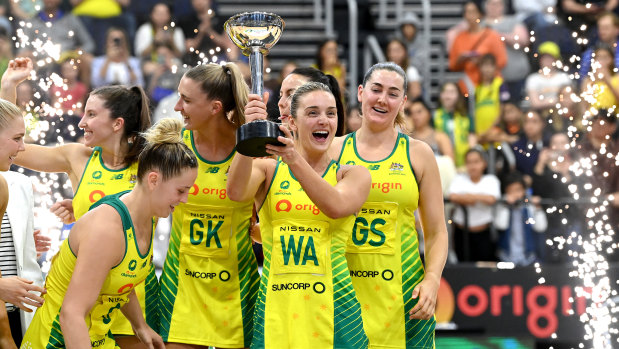 Victors on the court: Diamonds captain Liz Watson holds the Constellation Cup after beating New Zealand on Sunday night.