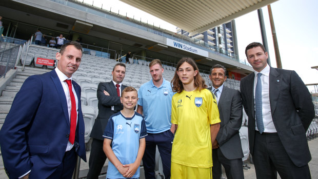 'Southern Expansion are not welcome in Wollongong': Wolves coach Luke Wilkshire (far left) and Sydney FC chairman Scott Barlow (far right) at Tuesday's announcement.