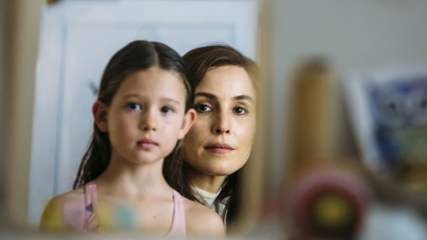 Annika Whiteley as Lola and Noomi Rapace as Lizzie.